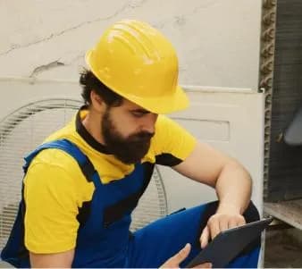 Dust Busters technician preparing to clean a Leduc home's system
